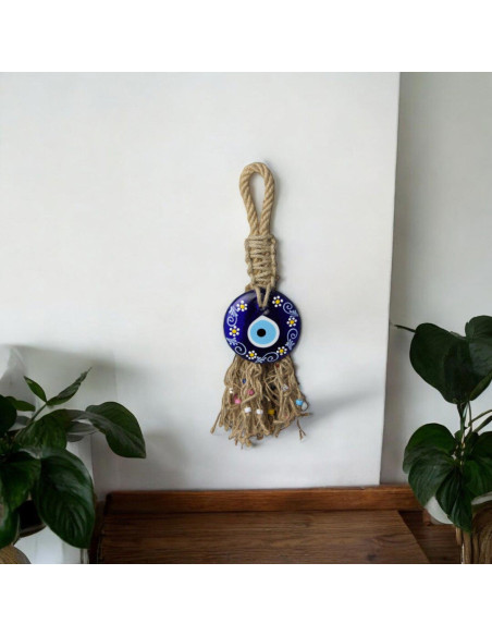 Œil bleu à fleurs blanches avec franges en jute