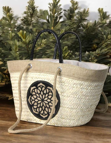 Wicker basket bag with black leather rosette