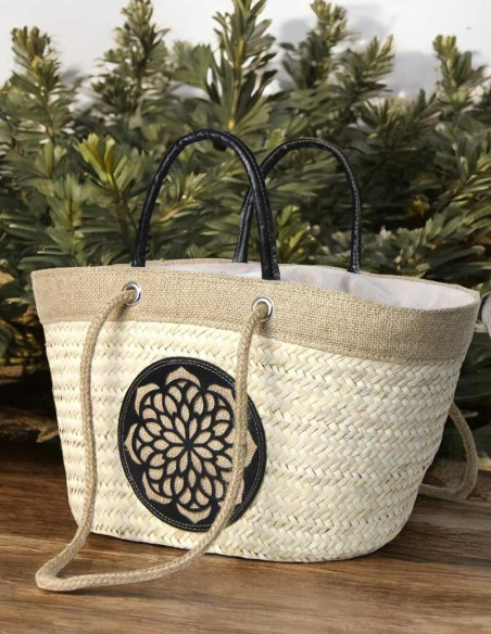 Wicker basket bag with black leather rosette
