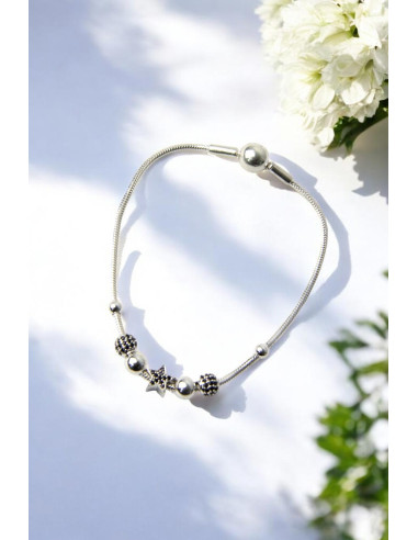 Silver bracelet with star charm