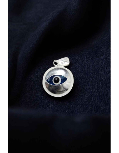 Domed silver pendant with blue eye