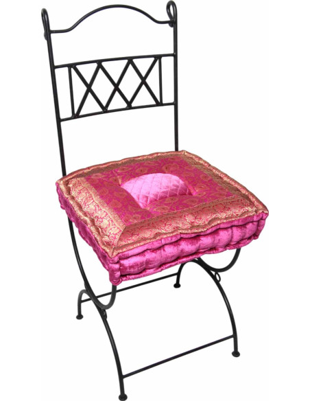 Wrought iron chair with fuchsia cushion