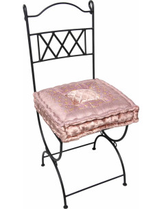 Wrought iron chair with powder pink cushion