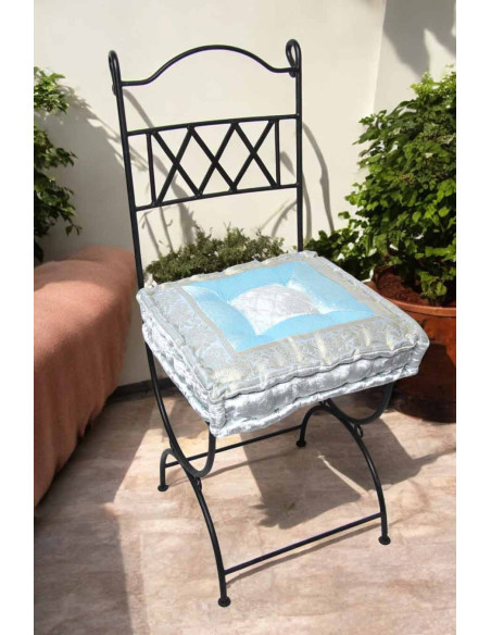 Wrought iron chair with white and sky blue cushion