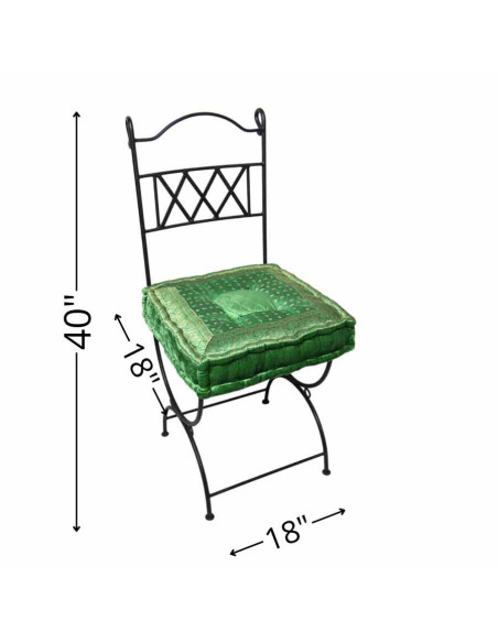 Wrought iron chair with green cushion