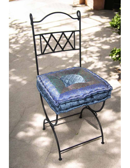 Wrought iron chair with lavender blue cushion