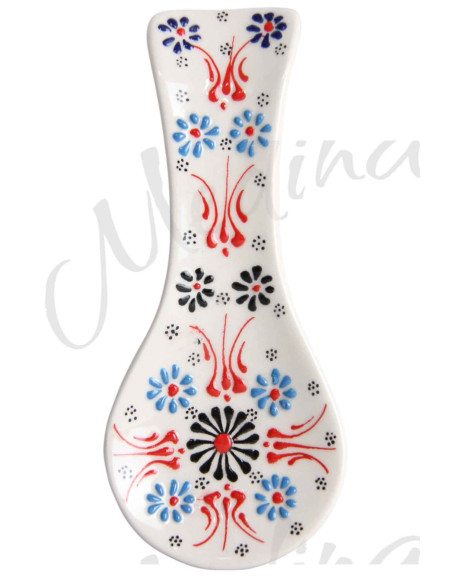 White Turkish spoon rest with blue flowers and black rosette