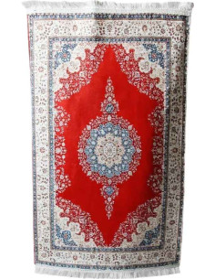 Turkish rug in red with blue medallion, 26 x 45 in